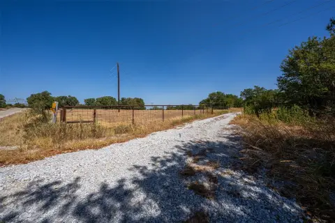 Fenced Agricultural Land with Pond