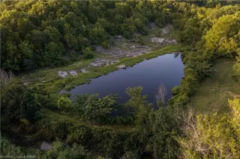 Partially Wooded Land with Pond