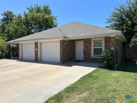 Brick Duplex With Attached Garages