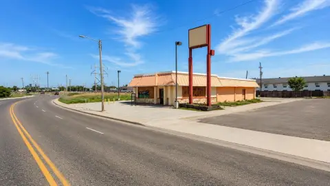 Corner Storefront With Billboard