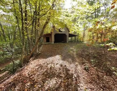 Mountain Land with Creek and Barn