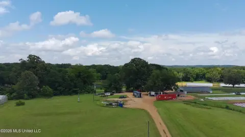 Zoned Commercial Land With Two Buildings