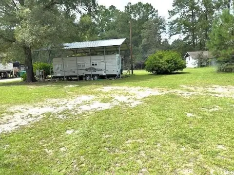 Riverfront Residential Lot with Camper