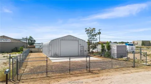 Fenced Flex Building with Garage Door