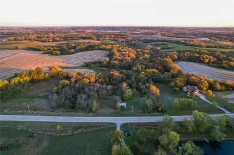Wooded Acreage with Pond and Garage