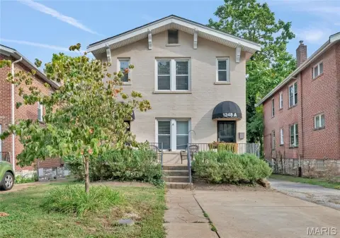 Two-Unit Duplex with Sunrooms