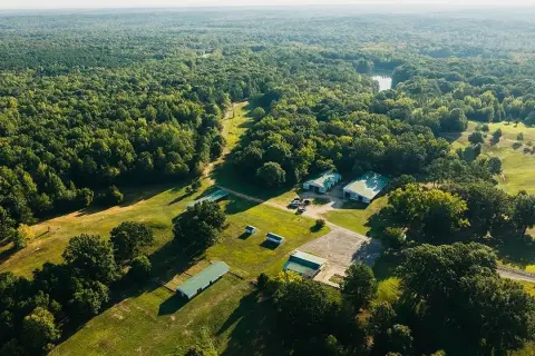 Farm With Lake and Timber