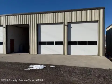 Rifle Warehouse with Roll-Up Doors
