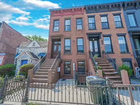 Two Brownstone Buildings, One Lot