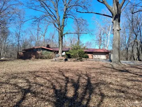 Wooded Commercial Land with Existing Building
