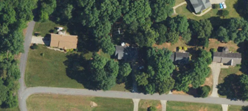 Wooded Homesite Bordering Floyd’s Creek