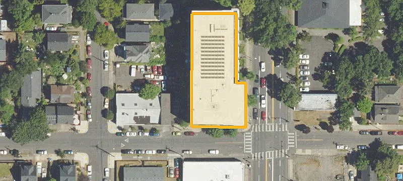 Concrete Building with Fenced Parking