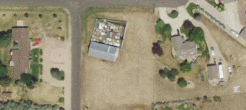 Undeveloped Lot with Storage Building