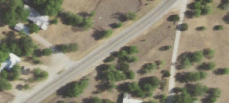 Versatile Acreage with Barns and Well