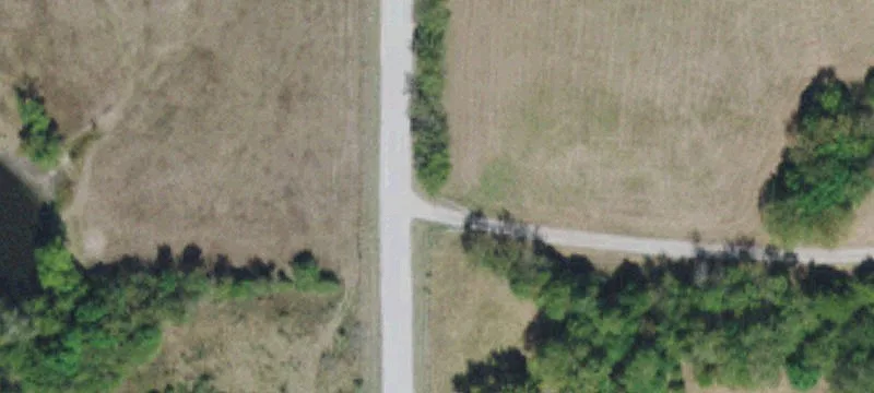 Versatile Acreage with Recreational Features