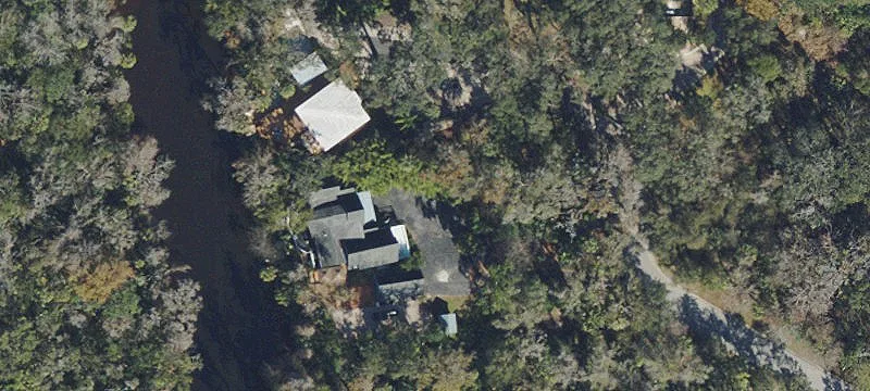 Riverfront Estate with Income Potential