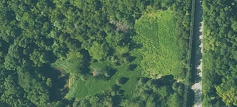 Partially Wooded Land with Pond
