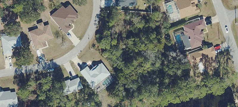 Residential Home Lot with Greenspace Backdrop
