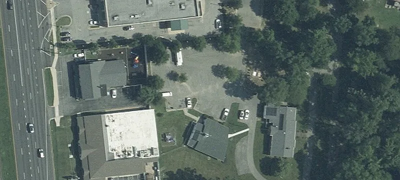 Steepled Church with Paved Parking