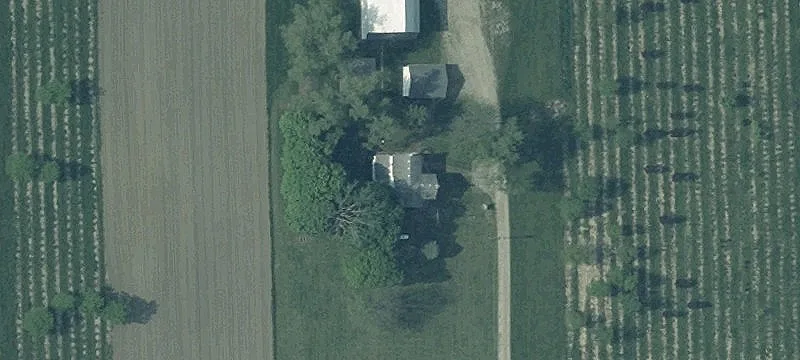 Tiled Farmland with Barn and Pond