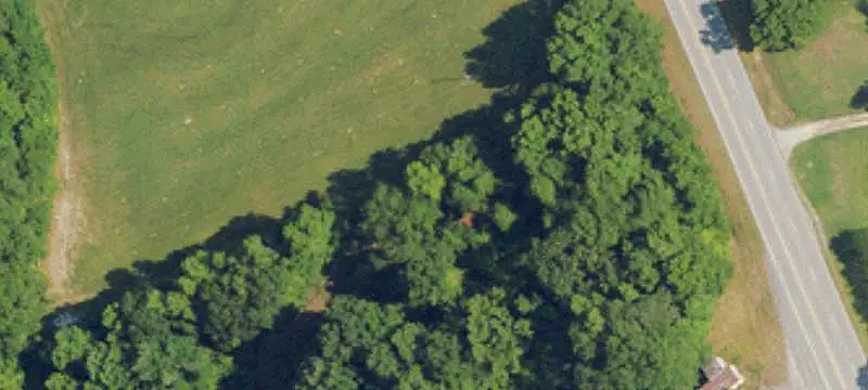 Unzoned Wooded Land with Barns