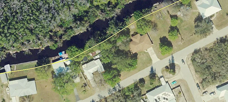 Fenced Waterfront Canal Lot