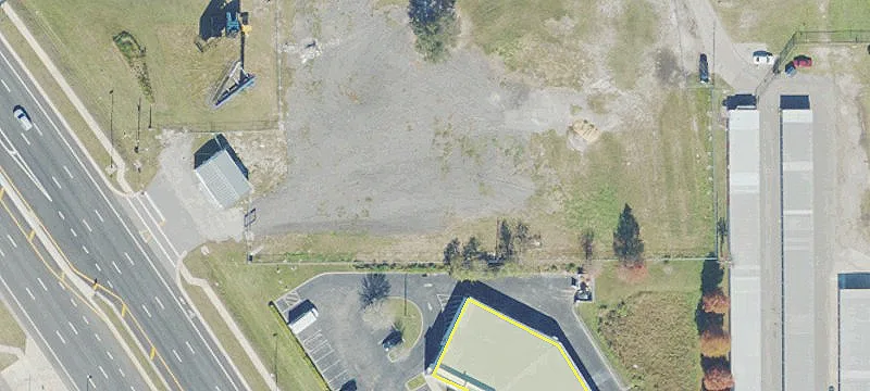 Fenced Commercial Land with Building
