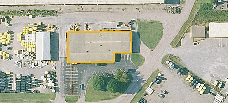 Fenced Warehouse with Overhead Doors