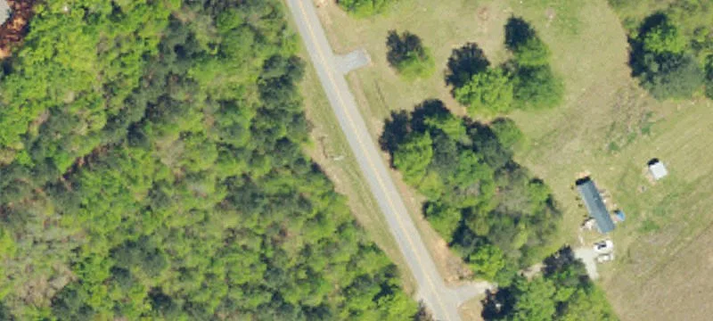 Unrestricted Wooded Waterfront Land