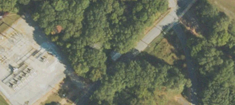 Wooded Industrial Land with Paved Frontage