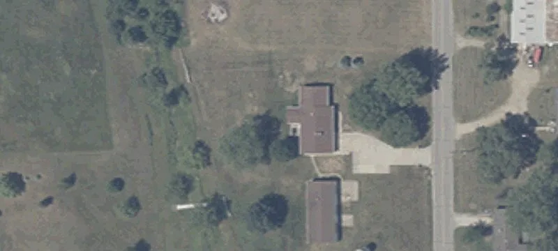 Mostly Wooded Land with Pole Building