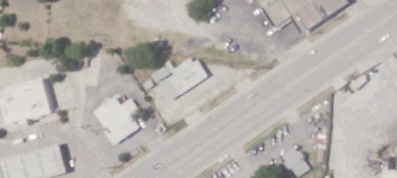 Used Car Sales Lot with Building