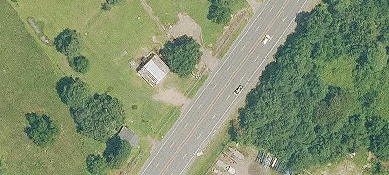 Cleared Land with Metal Warehouse