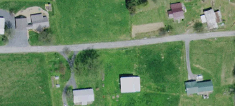 47-Acre Farm with Creek and Barns