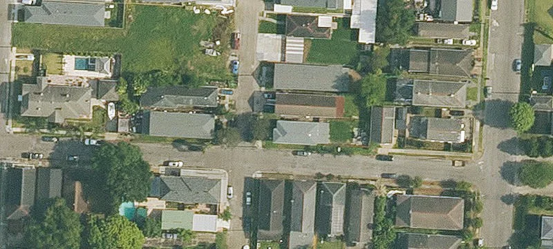 Corner-Lot Duplex With Screened Porches