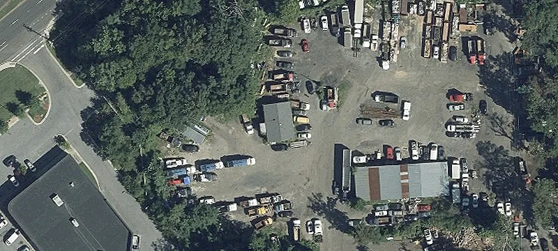 Fenced Industrial Land with Metal Building