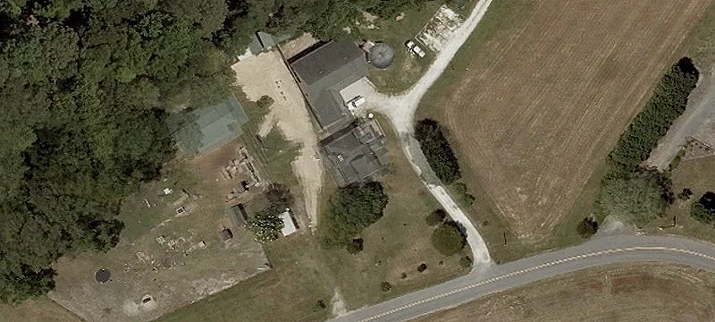 Farmhouse with Barn and Fenced Pastures