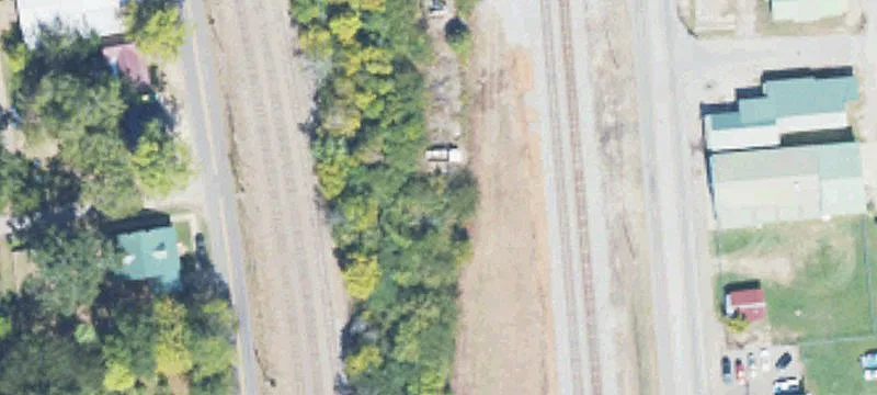 Commercial Land with Fire-Damaged Structure