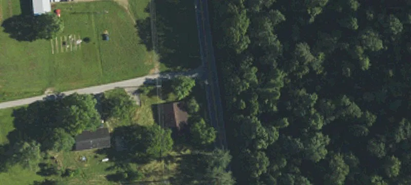 Wooded Hillside Land with Level Area