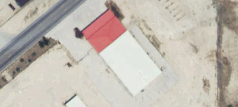 Fenced Industrial Yard with Buildings