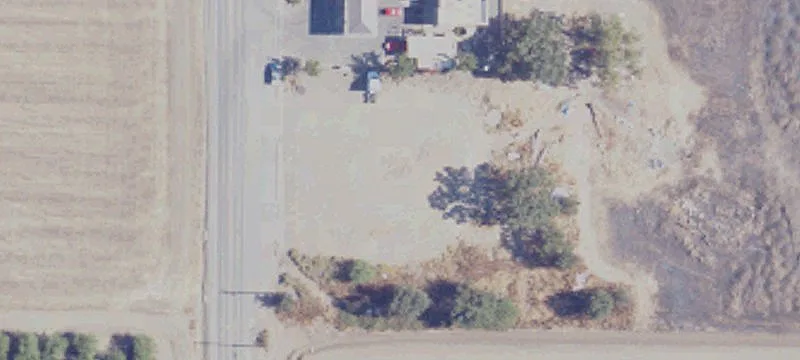Fenced, Graveled Industrial Lot
