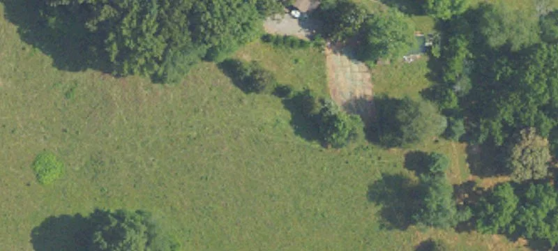 Level Land with Lake and Outbuildings