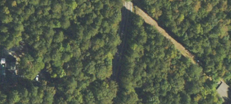 Wooded Acreage with Barn and Creek