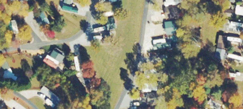 RV Park Lot with Creekside Backdrop