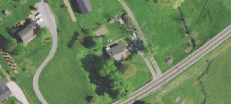 Acreage with Outbuildings and Creek
