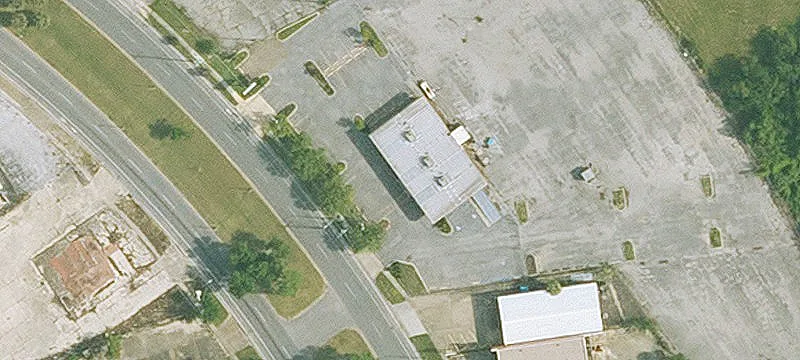 Paved Parking Lot with Building