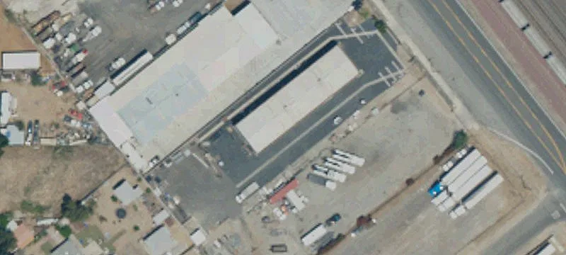 Fenced Warehouse with Roll-Up Doors