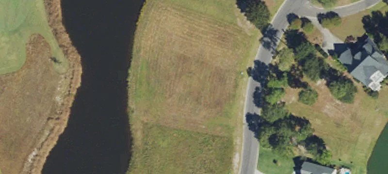 Pond-Front Homesite in Gated Golf Community