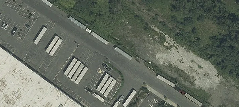 Garage with Fenced Parking Lot