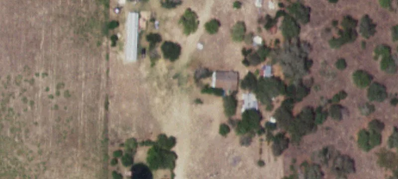 Metal Shop with Pond and Outbuildings